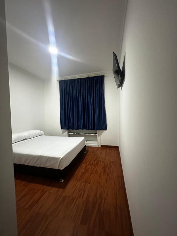 Postel nebo postele na pokoji v ubytování Hotel Artistico