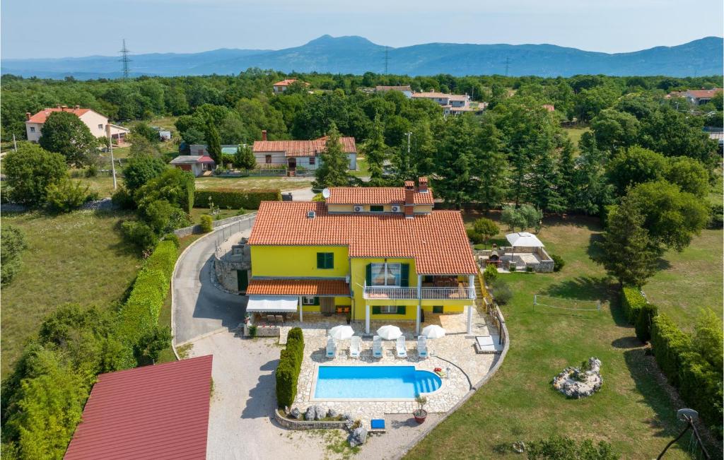 an aerial view of a house with a swimming pool at Awesome Apartment In Labin With House A Panoramic View in Nedeščina