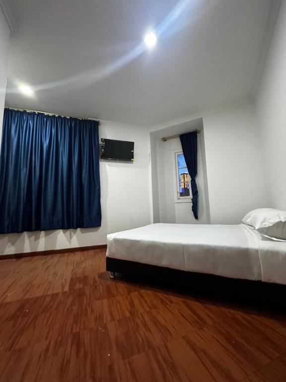 Postel nebo postele na pokoji v ubytování Hotel Artistico