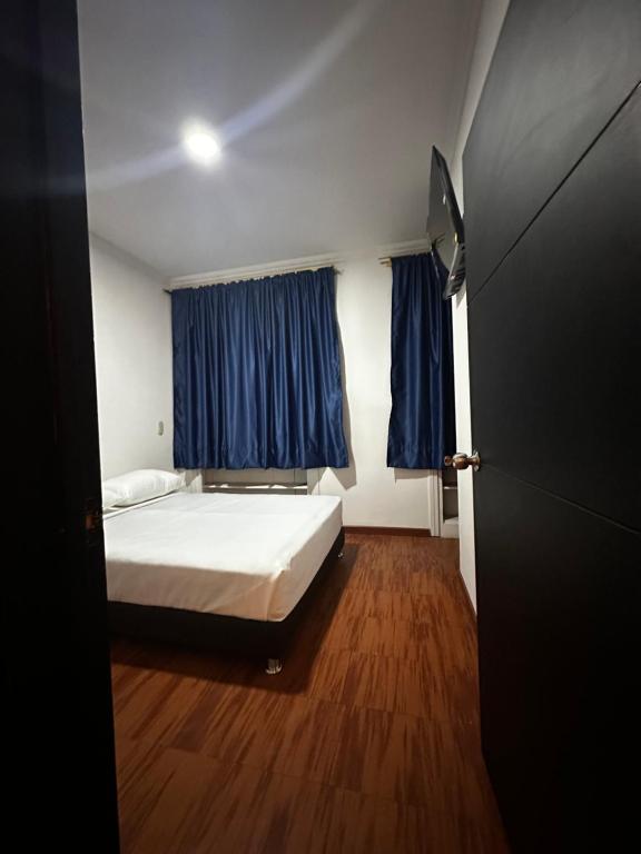 Postel nebo postele na pokoji v ubytování Hotel Artistico
