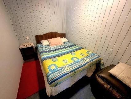 Кровать или кровати в номере cabaña amoblada independiente, sector regional