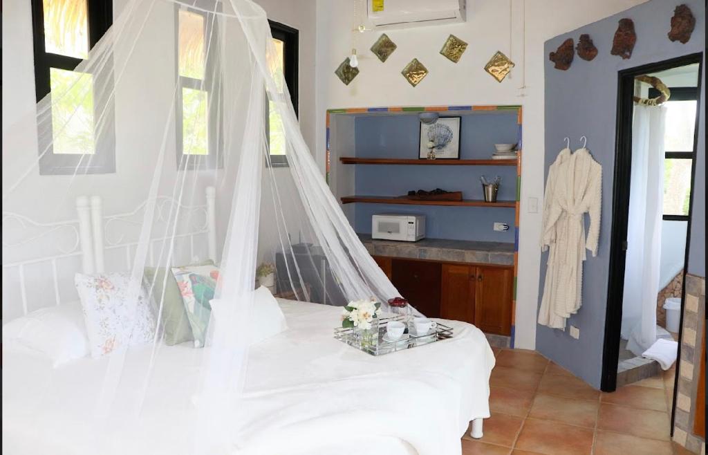 Postel nebo postele na pokoji v ubytování Villa La Fortuna Altos del Maria