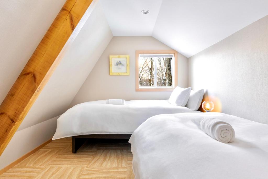 Letto o letti in una camera di Piccolo House