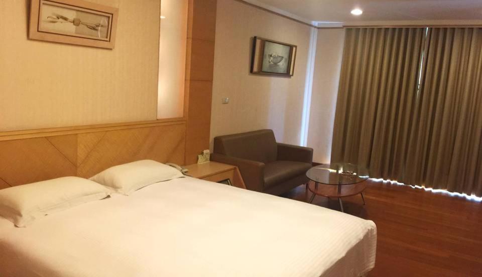 Ένα ή περισσότερα κρεβάτια σε δωμάτιο στο Jia Yun Business Hotel
