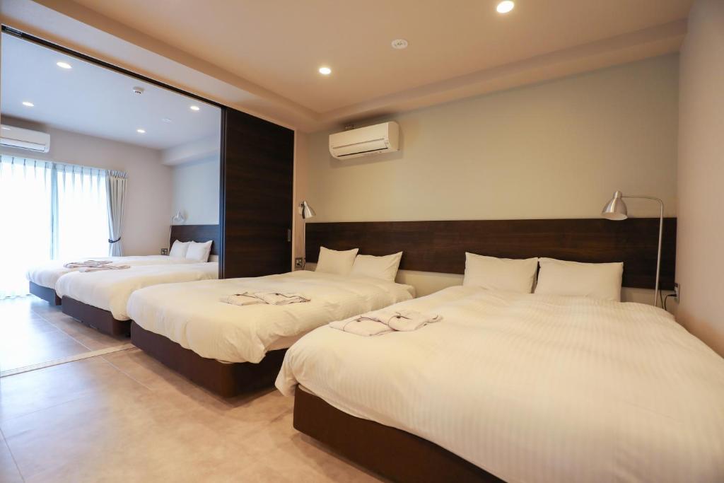 Postel nebo postele na pokoji v ubytování HOTEL so SUMIYOSHI