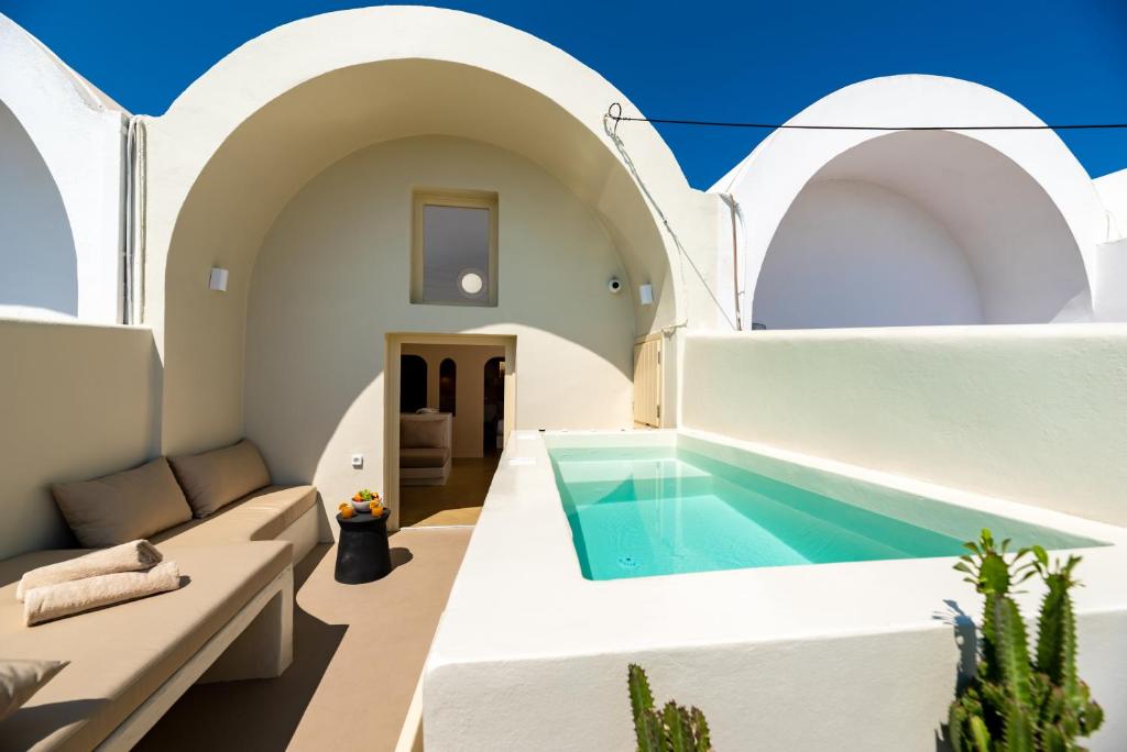 a villa with a swimming pool in santorini at RockHill Luxury Suite Imerovigli in Fira