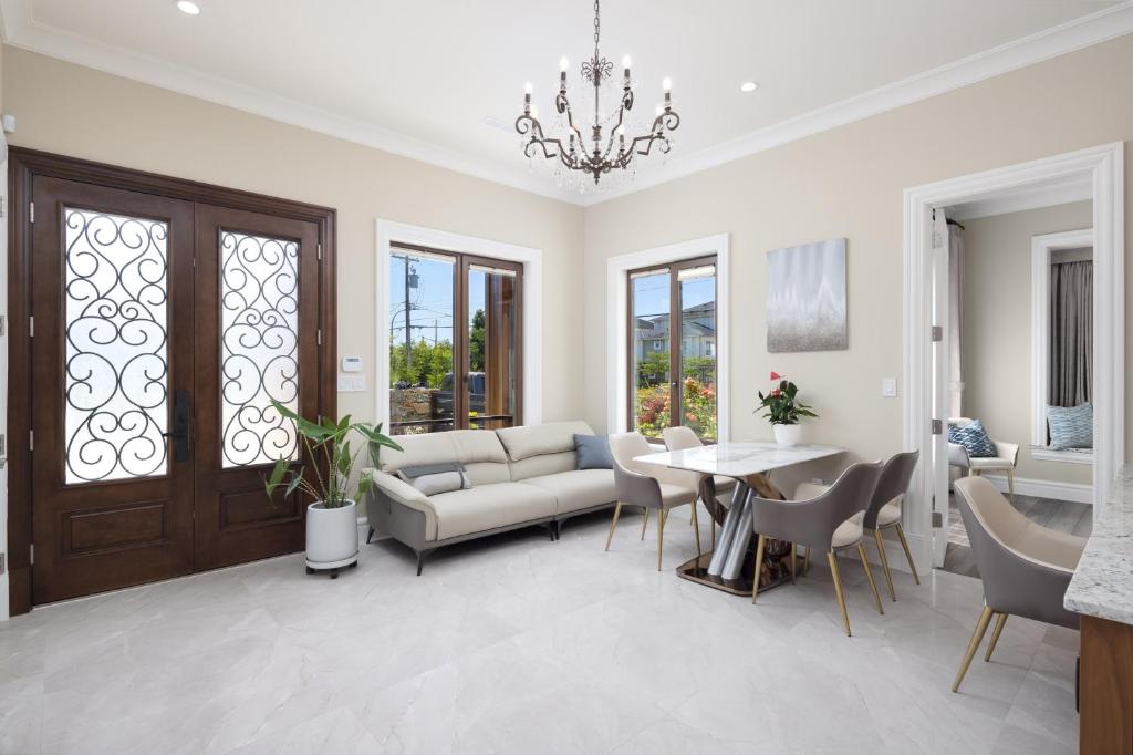 a living room with a couch and a table at Vancouver Vacation Home in Richmond