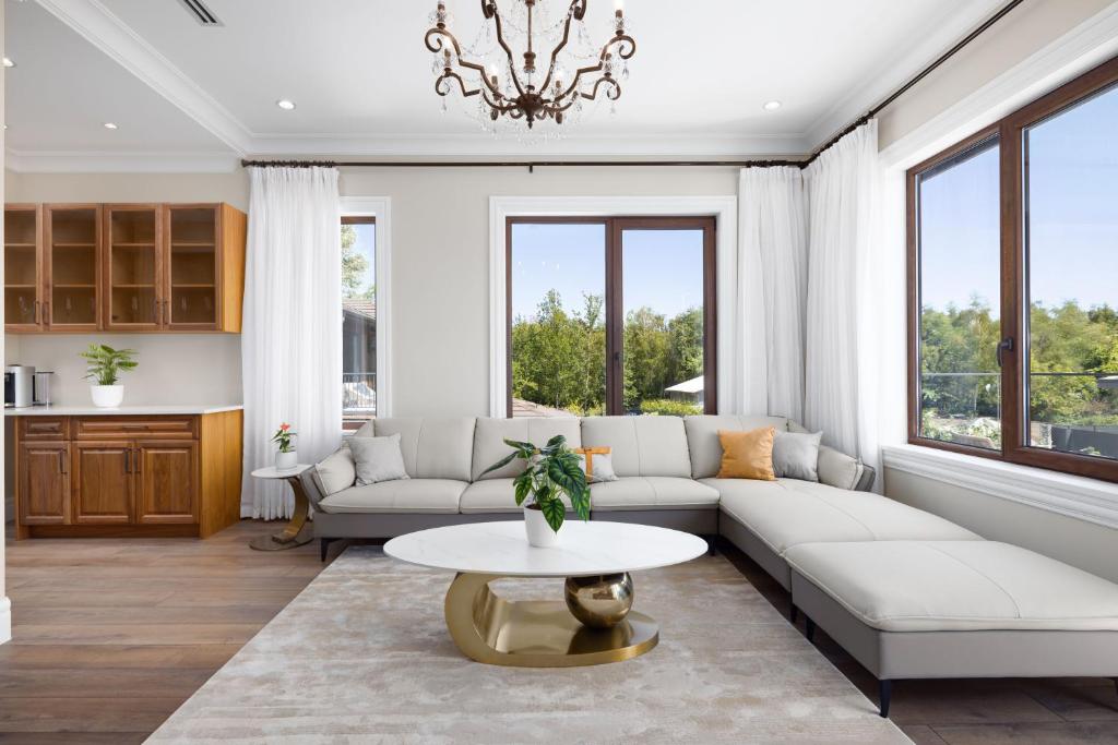 a living room with a couch and a table at Vancouver Vacation Home in Richmond