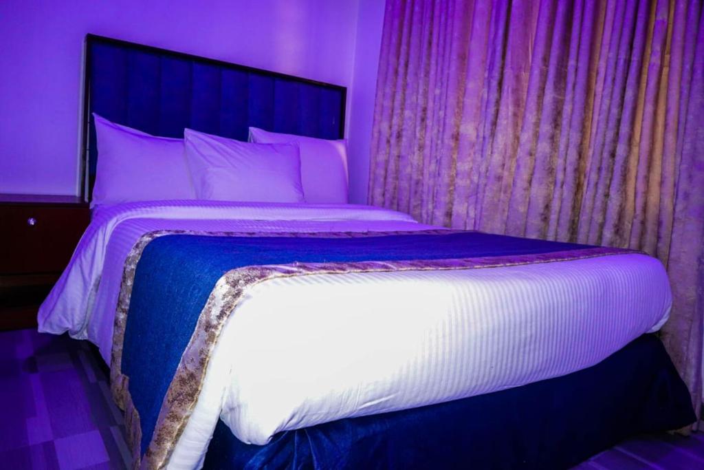Postel nebo postele na pokoji v ubytování Credence Resorts Aco