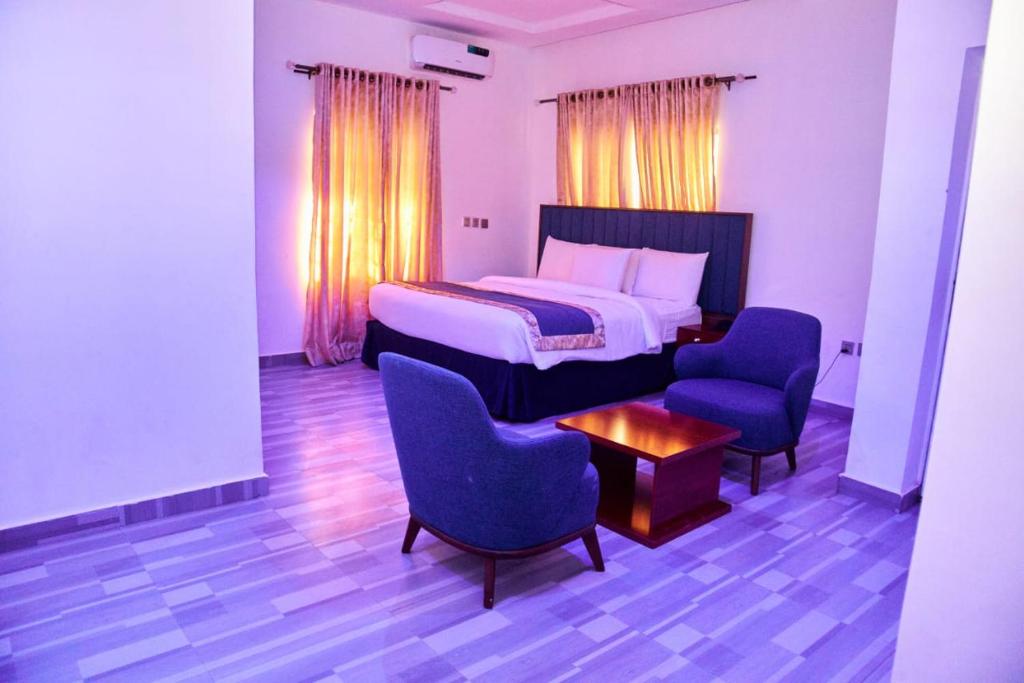 Postel nebo postele na pokoji v ubytování Credence Resorts Aco