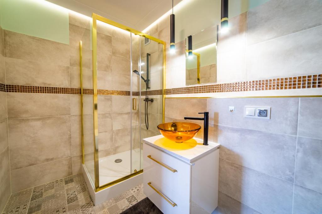 Kúpeľňa v ubytovaní Apartamenty Mazurskie