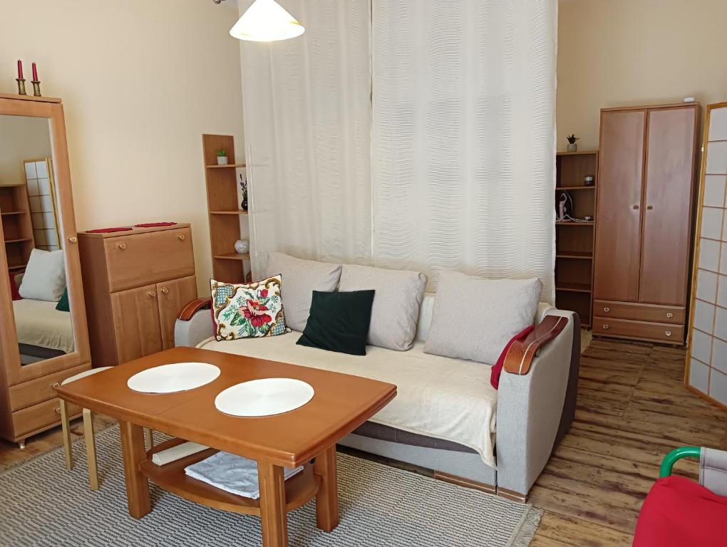 a living room with a couch and a table at Oficynka in Strzelce Opolskie