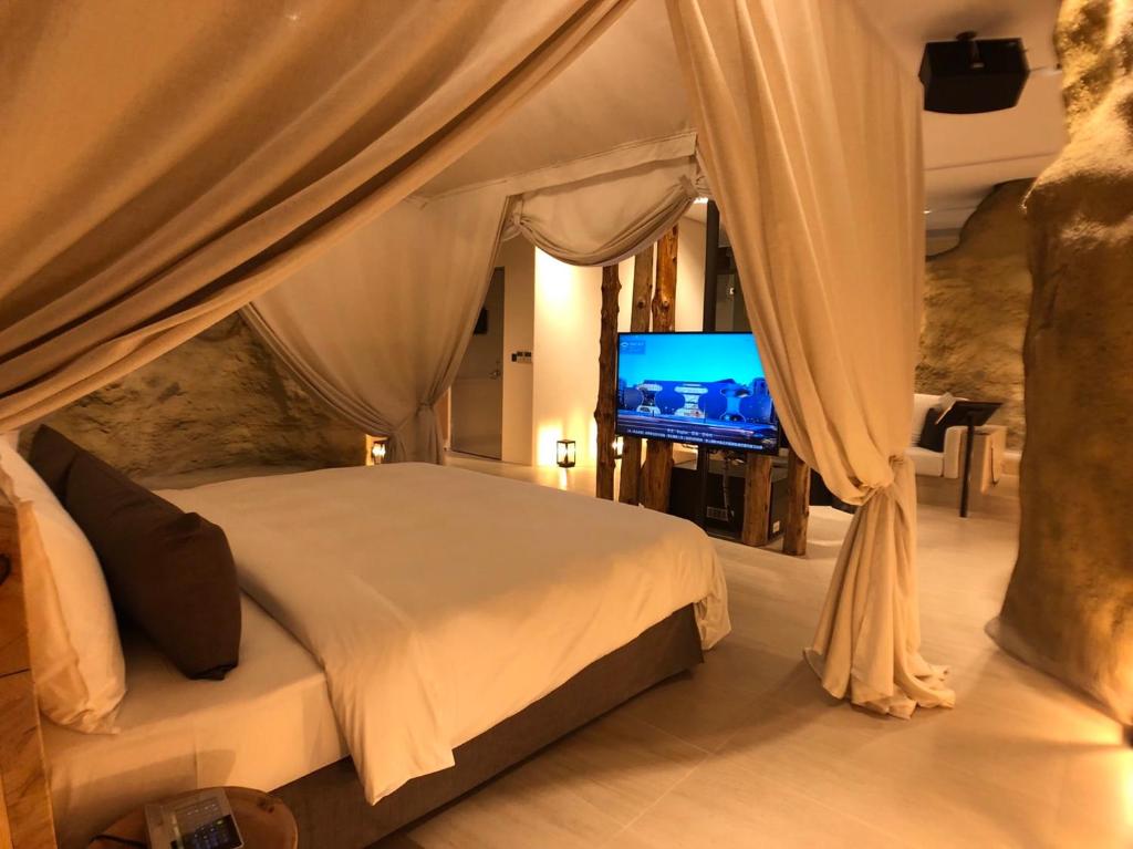 Postel nebo postele na pokoji v ubytování Birdman Motel