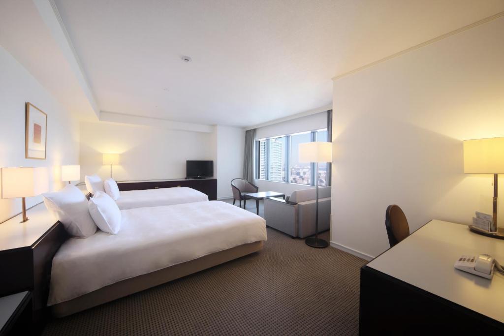 Postel nebo postele na pokoji v ubytování ANA Crowne Plaza Kobe by IHG
