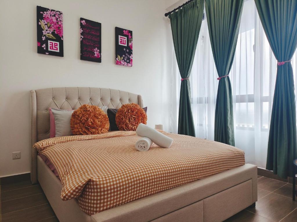 a bedroom with a bed with green curtains at #Free Netflix 1BR Troika Residensi Kota Bharu By AGhome in Kota Bharu