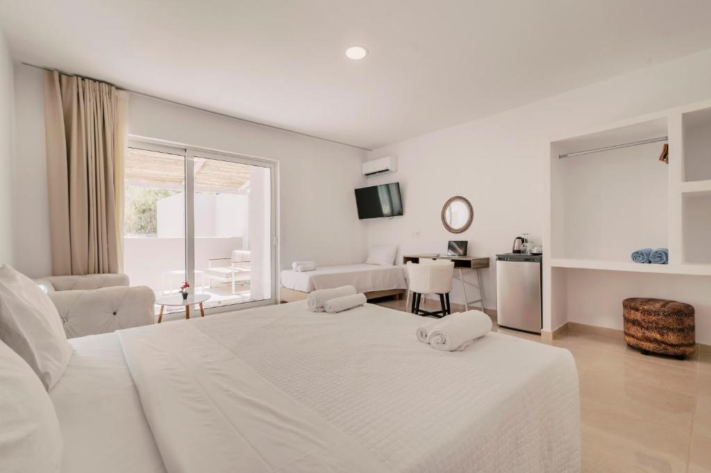 Ένα ή περισσότερα κρεβάτια σε δωμάτιο στο Bamboo Suites Hotel