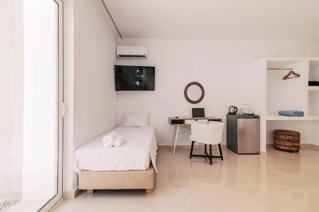 Ένα ή περισσότερα κρεβάτια σε δωμάτιο στο Bamboo Suites Hotel