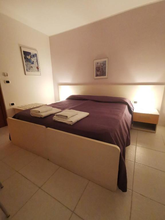 Postel nebo postele na pokoji v ubytování B&B Donna Nina