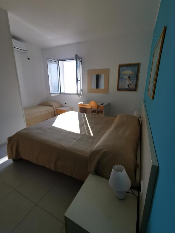 Postel nebo postele na pokoji v ubytování B&B Donna Nina