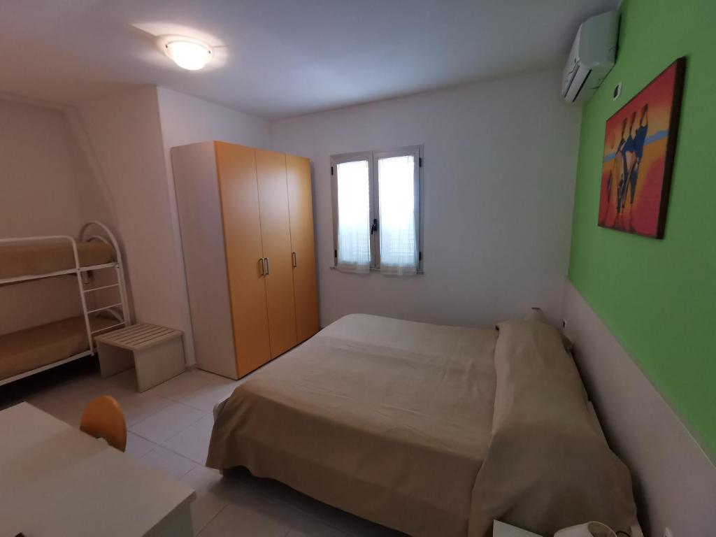 Postel nebo postele na pokoji v ubytování B&B Donna Nina