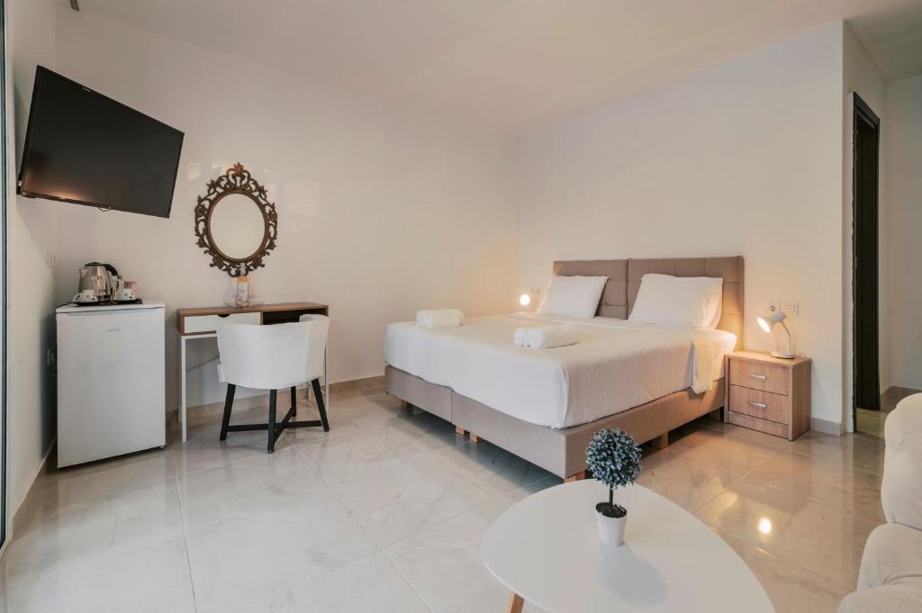 Ένα ή περισσότερα κρεβάτια σε δωμάτιο στο Bamboo Suites Hotel