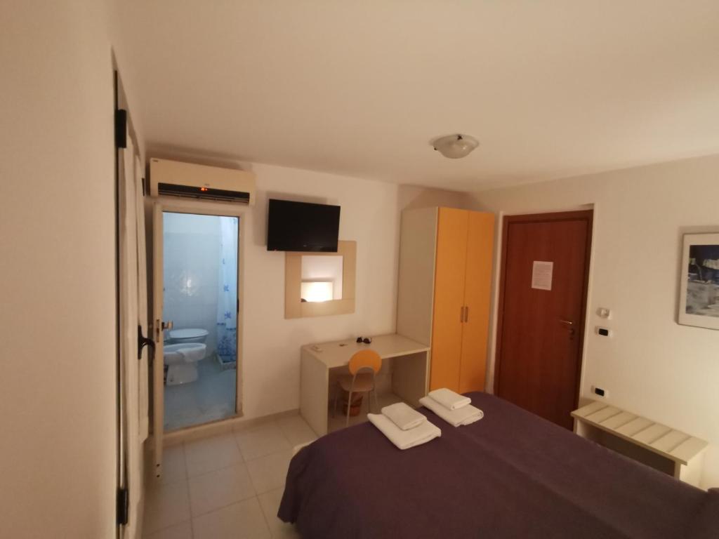 Postel nebo postele na pokoji v ubytování B&B Donna Nina