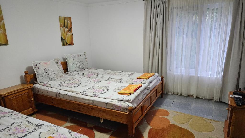 A bed or beds in a room at Guest House By The River