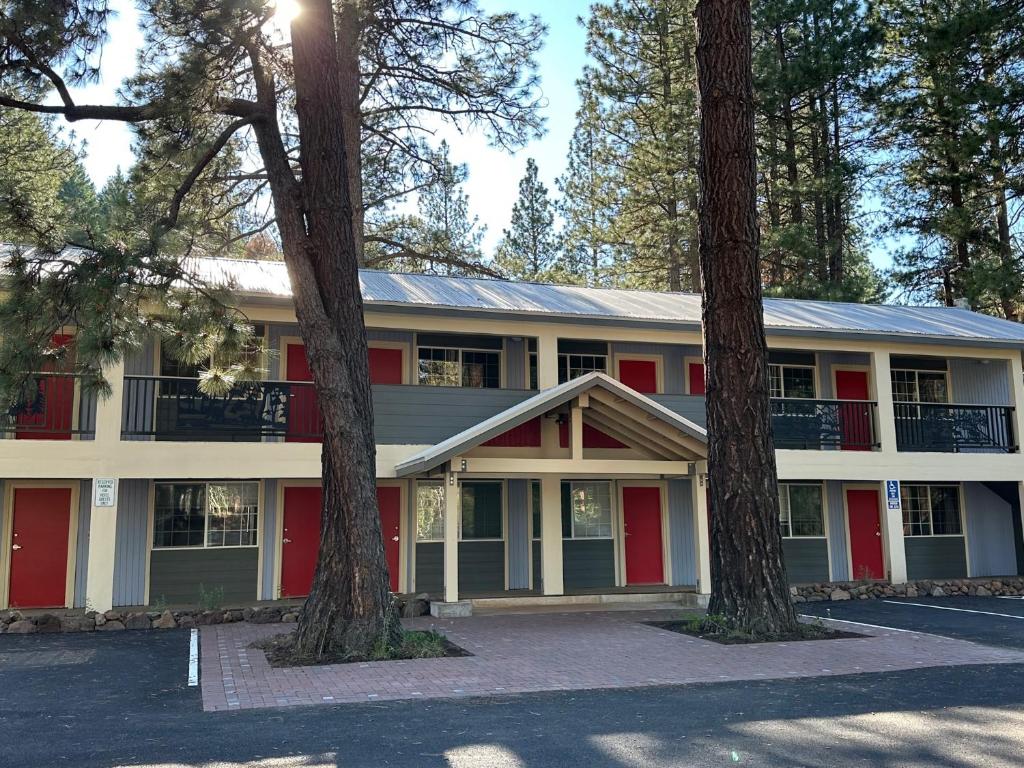 an exterior view of a building with trees at Crater Lake Gateway - Hwy 140 in Klamath Falls