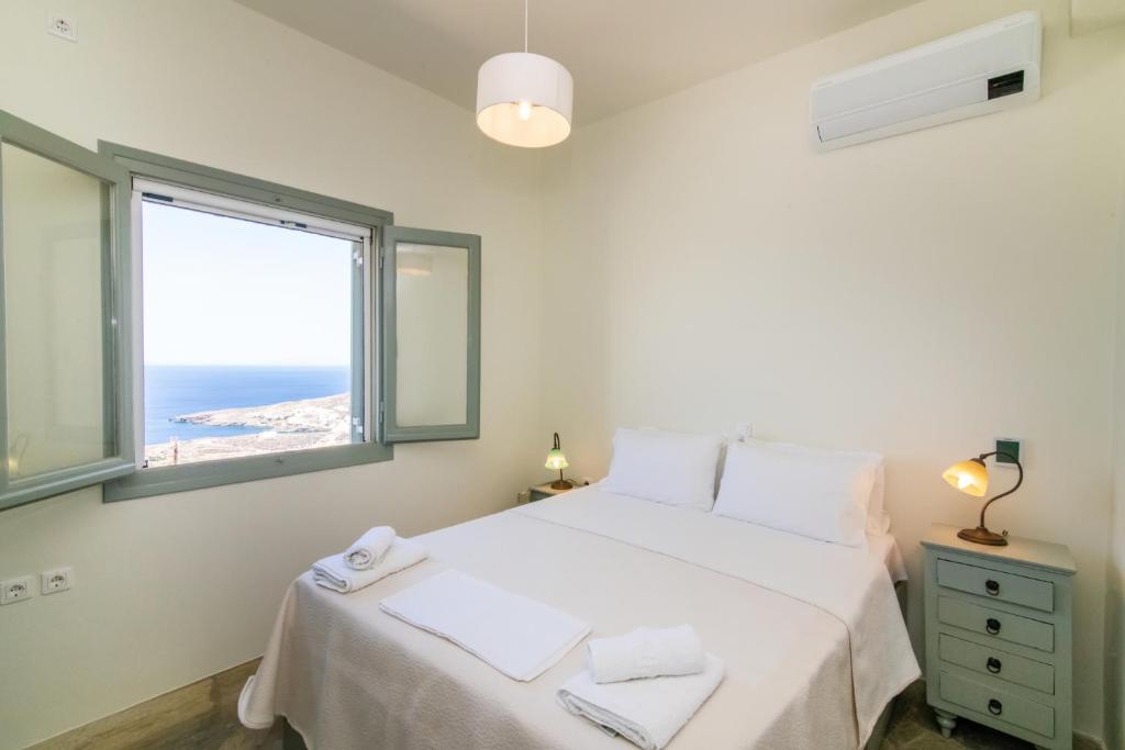 Postel nebo postele na pokoji v ubytování ReGenesis Villas