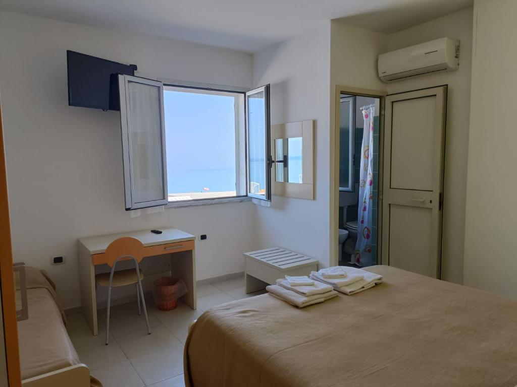 Postel nebo postele na pokoji v ubytování B&B Donna Nina
