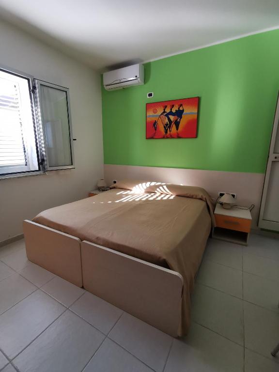 Postel nebo postele na pokoji v ubytování B&B Donna Nina