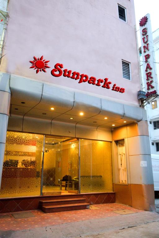 a shop with a sign on the front of it at Hotel Sunpark Inn in Chennai