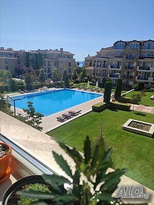 a view of a swimming pool in a building at Apartments Atia Resort in Chernomorets