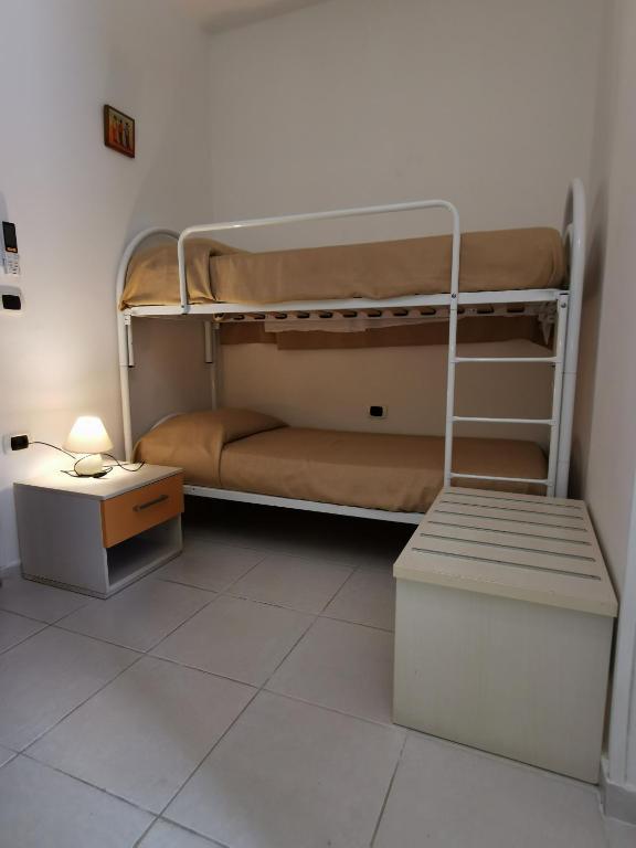 Postel nebo postele na pokoji v ubytování B&B Donna Nina