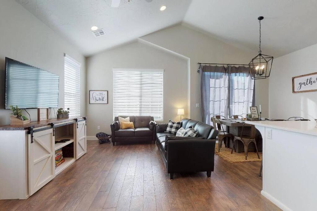 a living room with a couch and a table at Good To Be Home where your family can relax in Washington