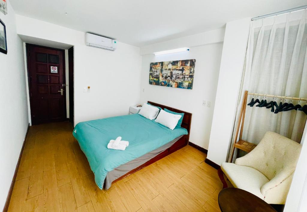 Postel nebo postele na pokoji v ubytování Onestar Danang Riverside