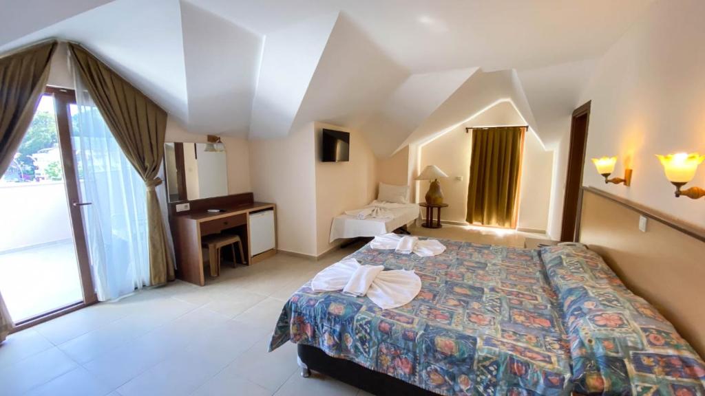 Postel nebo postele na pokoji v ubytování Felice Hotel