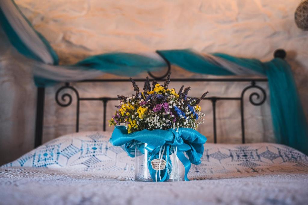A bed or beds in a room at Anemomylos-Windmill