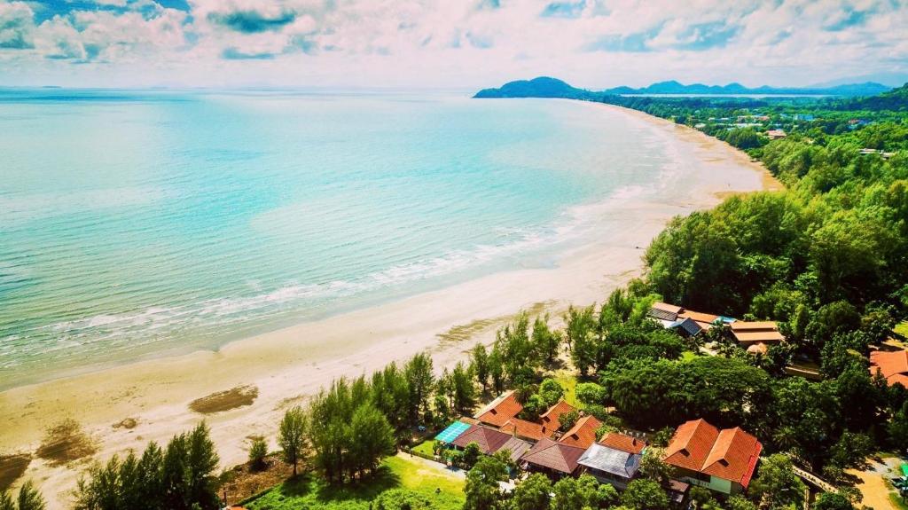 an aerial view of a beach with houses at Chanchaolao Beach Resort in Chao Lao Beach