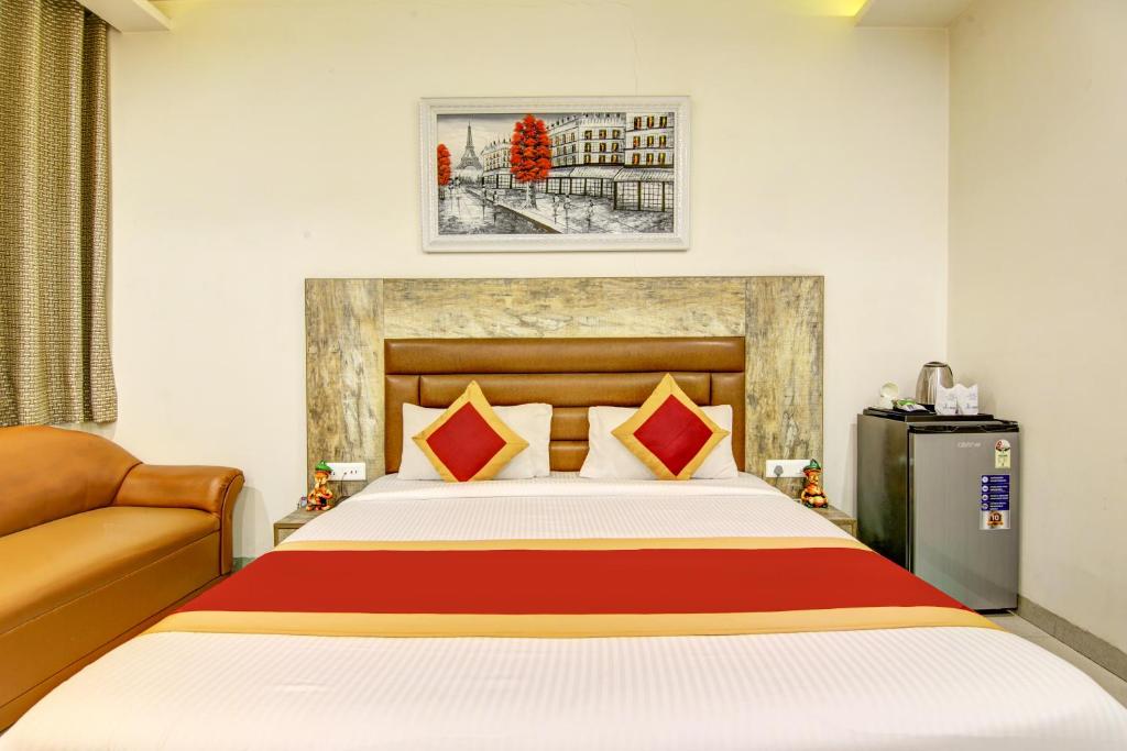 Postel nebo postele na pokoji v ubytování Gracious by Vishesh Hotels & Home Stay
