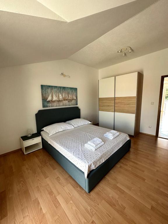 Posteľ alebo postele v izbe v ubytovaní Apartments Villa Ohana