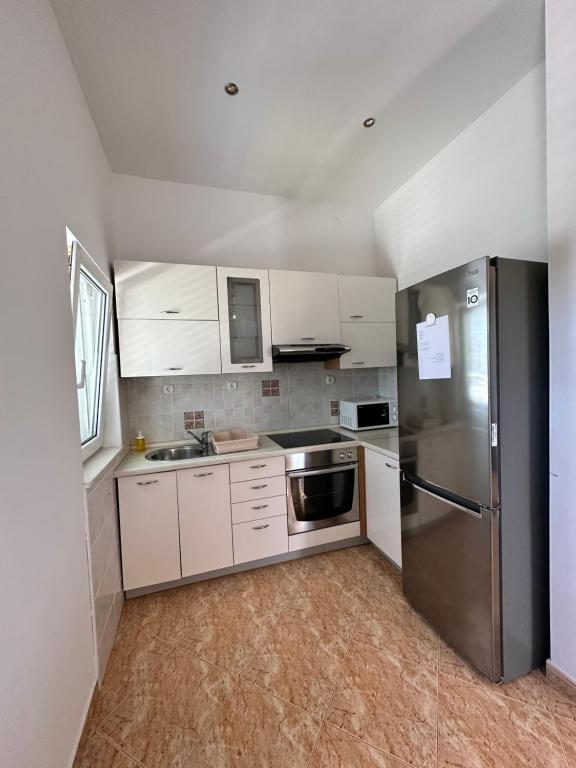 Kuchyňa alebo kuchynka v ubytovaní Apartments Villa Ohana