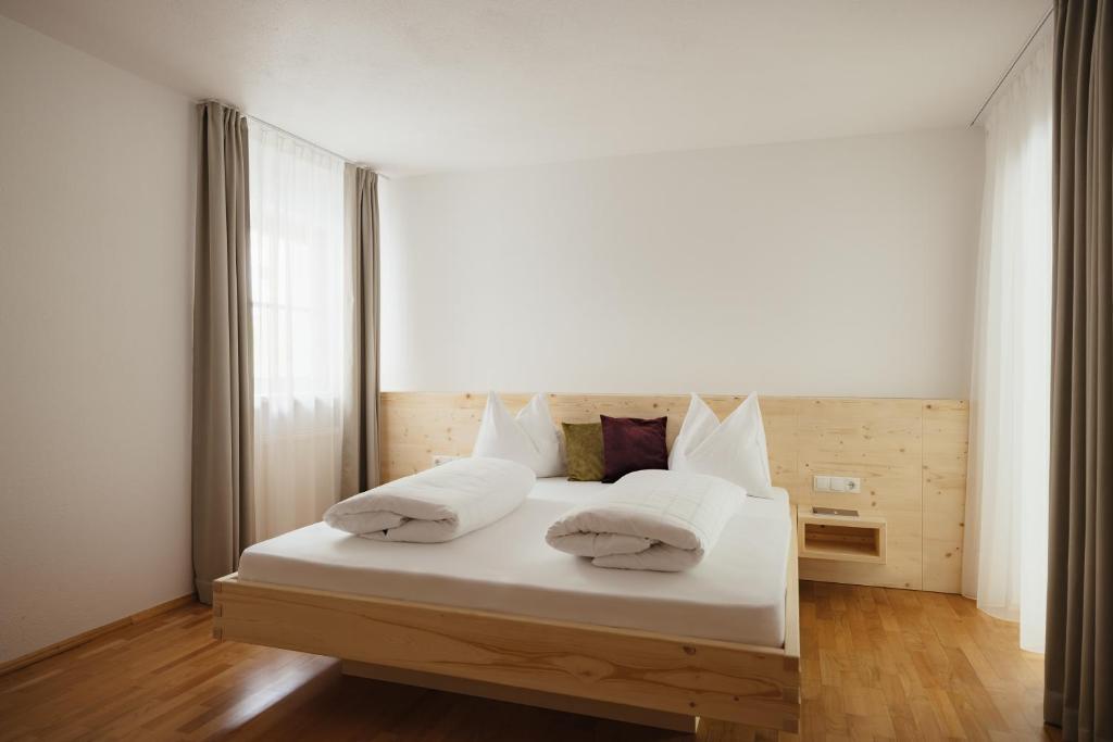 Postel nebo postele na pokoji v ubytování Untermairhof Appartment Residence