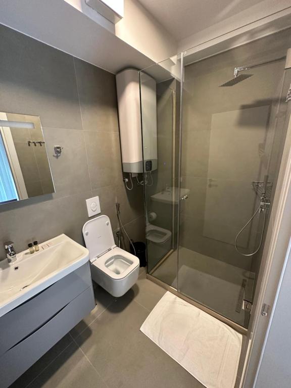 Koupelna v ubytování Soin Rooms