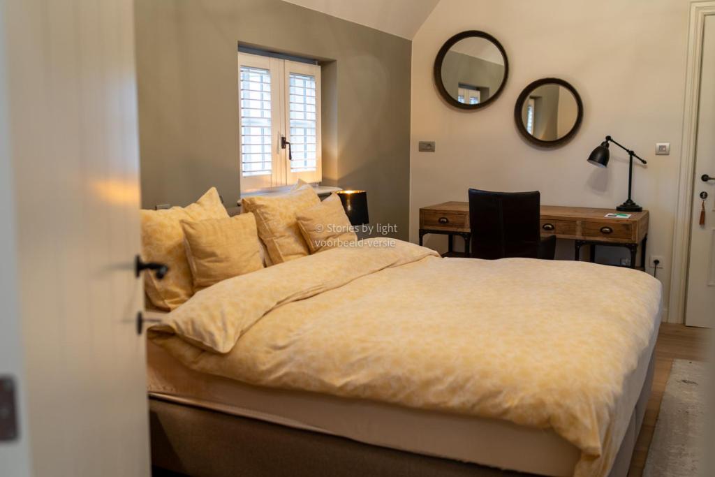 Postel nebo postele na pokoji v ubytování B&B Rosselaer