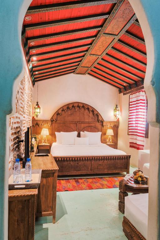 Uma cama ou camas num quarto em Riad Hicham