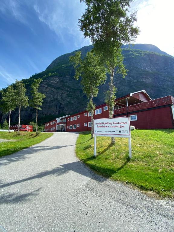 a sign on the side of a road in front of a building at Trædal Hotel in Sunndalsøra