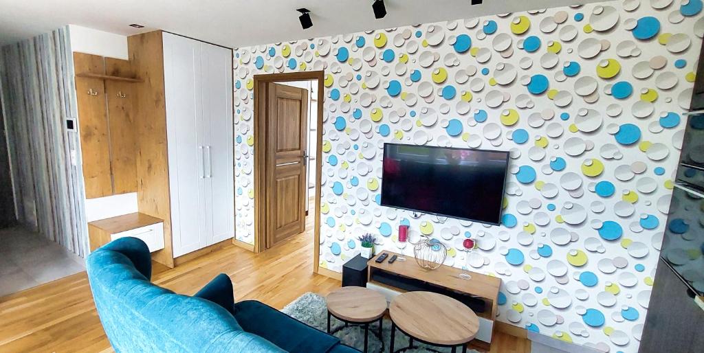 TV a/nebo společenská místnost v ubytování Apartament Noniewicza Centrum