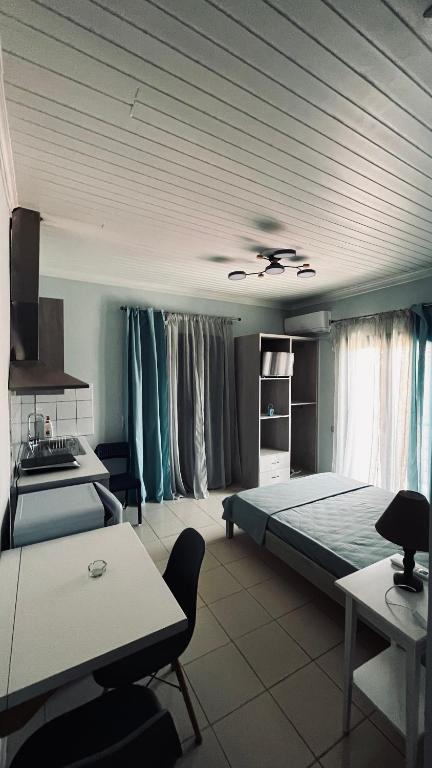 Posteľ alebo postele v izbe v ubytovaní Theros Room
