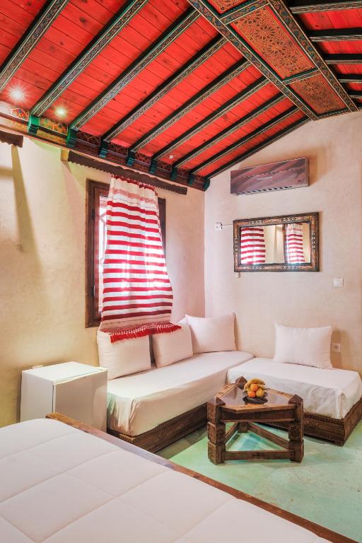 Uma cama ou camas num quarto em Riad Hicham